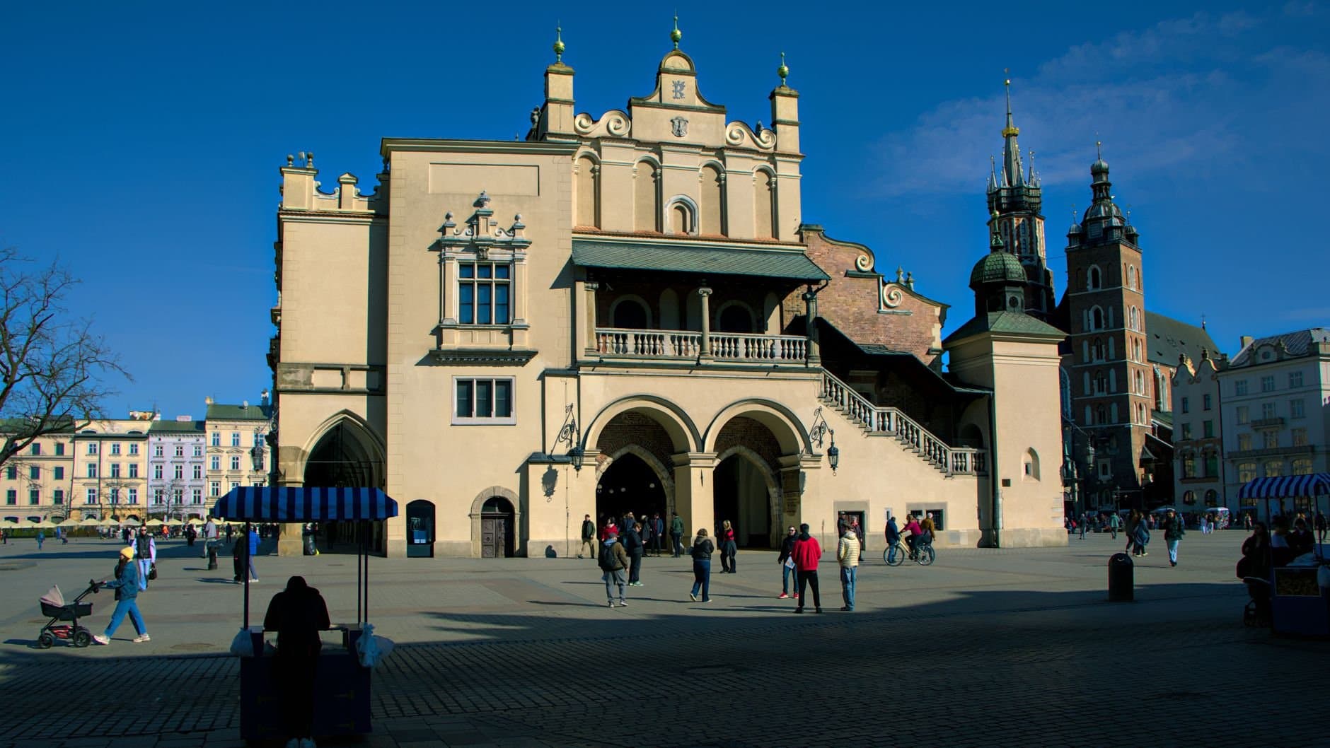 Explore the historic and vibrant architecture of Kraków's Market Square, a cultural hub.