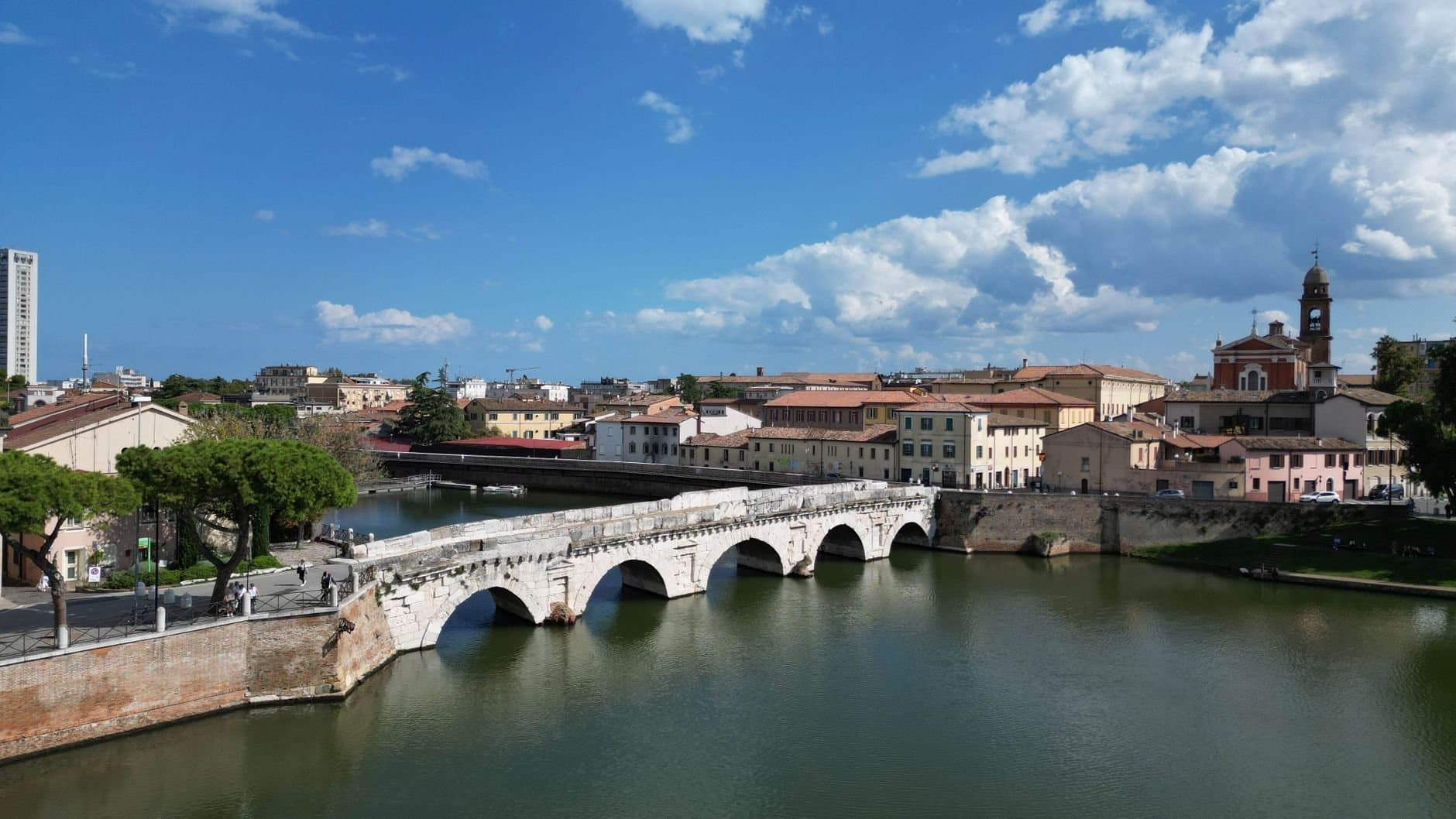 Scenic view of Tiberius Bridge over the Marecchia River in Rimini, Italy.